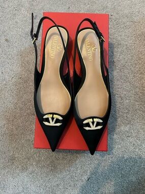Valentino Garavani Black Pointed Slingback Flats with Gold Logo Emblem